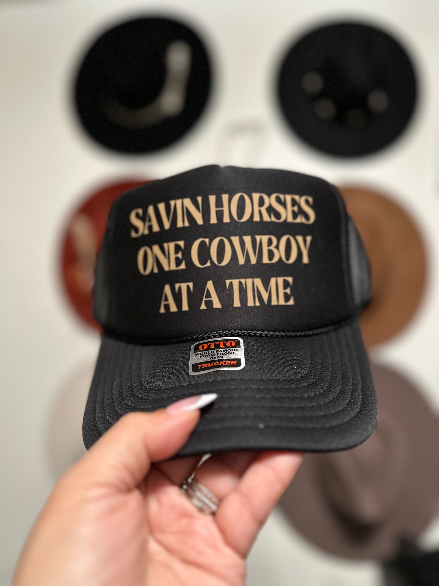 Savin Horses One Cowboy at a Time Trucker Hat